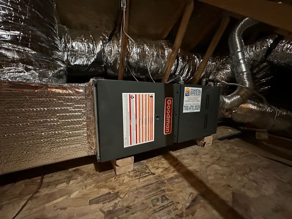 Goettl HVAC system installed in attic with ductwork and insulation visible.
