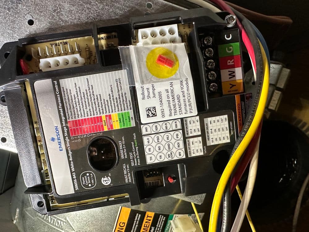 Emerson motor control wiring with labels, indicators, and connections on a gray background.