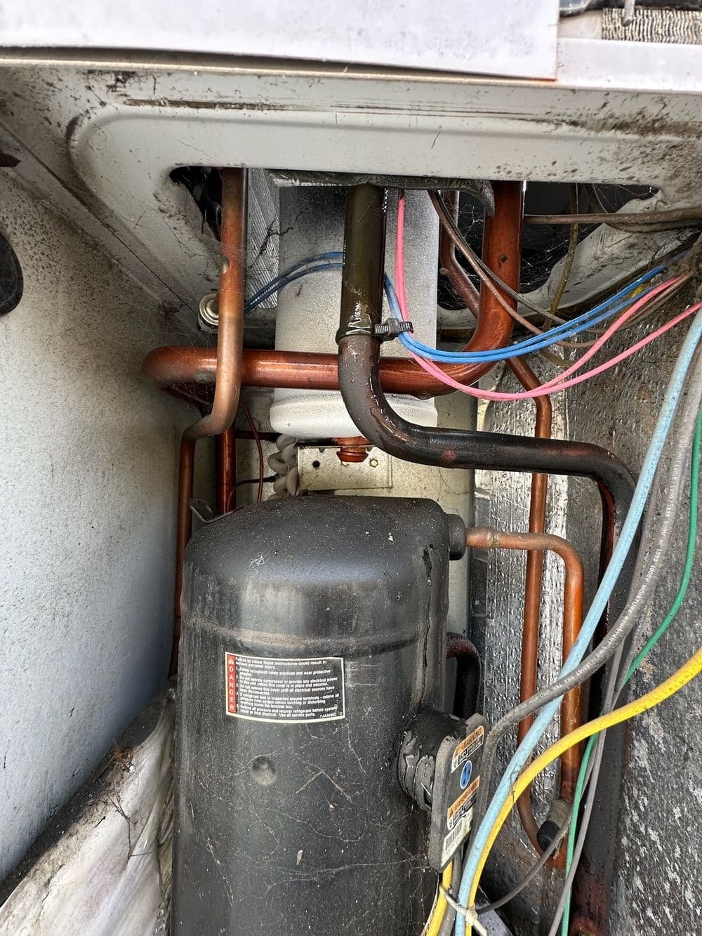 Inside an Aging AC Condenser During a Vista CA Service Call image